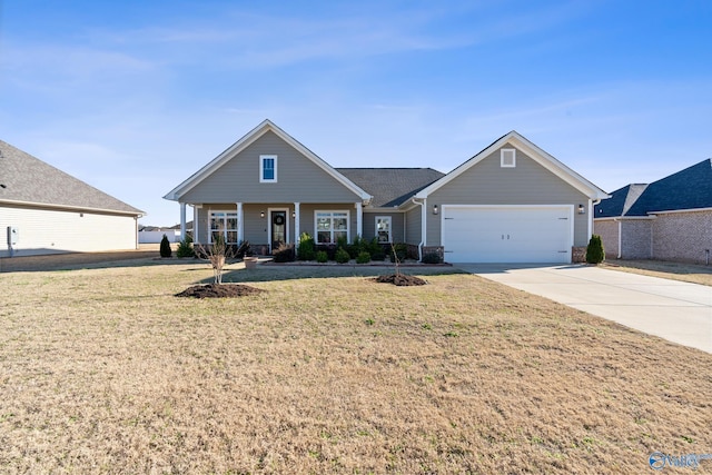 view of front of house featuring a front yard, concrete driveway, a porch, and an attached garage