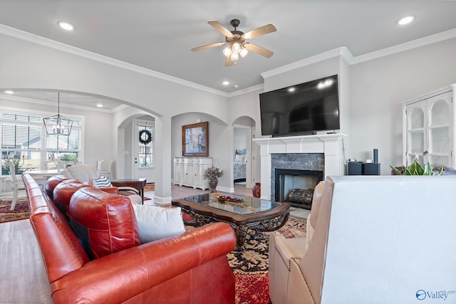 living area with ceiling fan, recessed lighting, wood finished floors, and a premium fireplace