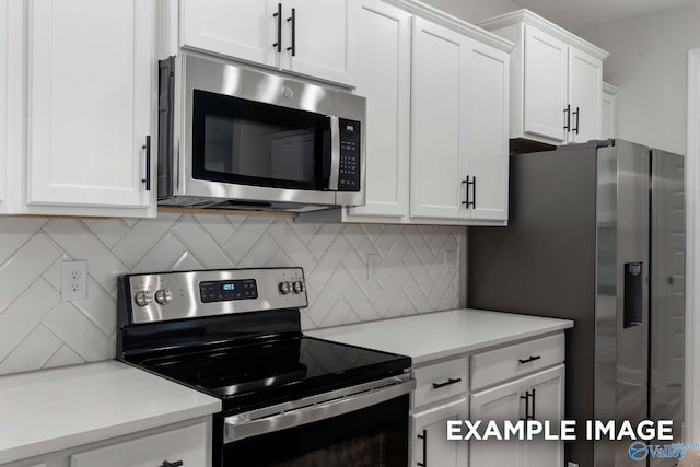 kitchen featuring backsplash, light countertops, white cabinetry, and stainless steel appliances
