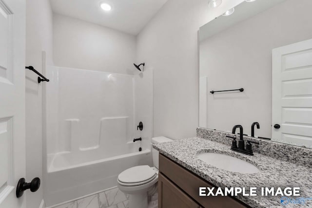 bathroom with bathtub / shower combination, vanity, marble finish floor, and toilet