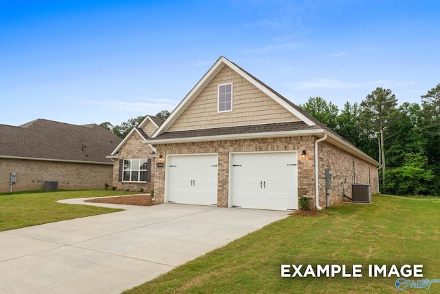 view of front of house featuring a garage, central AC unit, and a front lawn