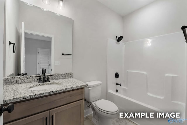bathroom featuring vanity, baseboards, bathing tub / shower combination, toilet, and marble finish floor