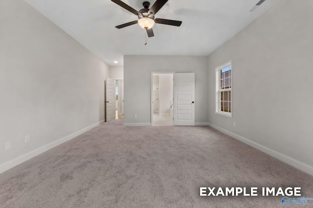 unfurnished bedroom featuring visible vents, baseboards, a ceiling fan, and carpet floors