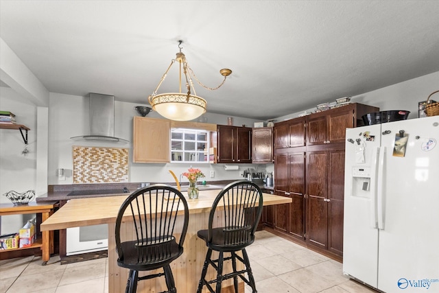 kitchen with white fridge with ice dispenser, black electric cooktop, dark brown cabinetry, wall chimney exhaust hood, and light tile patterned floors