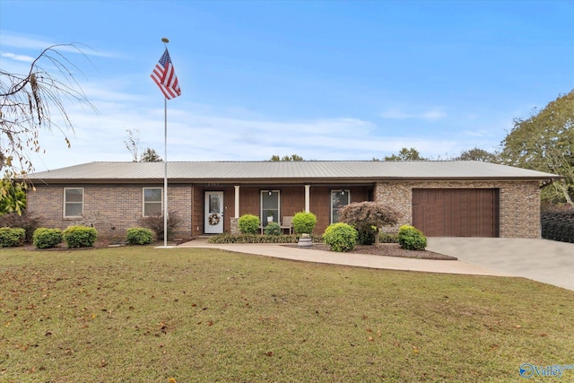 single story home with a front yard and a garage