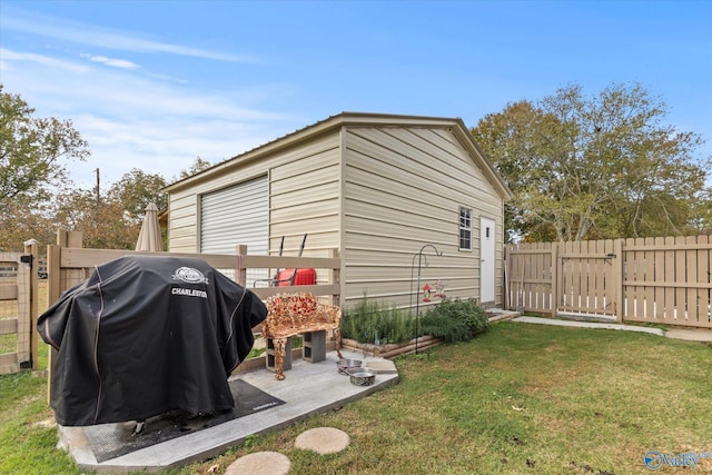 view of outdoor structure featuring a lawn