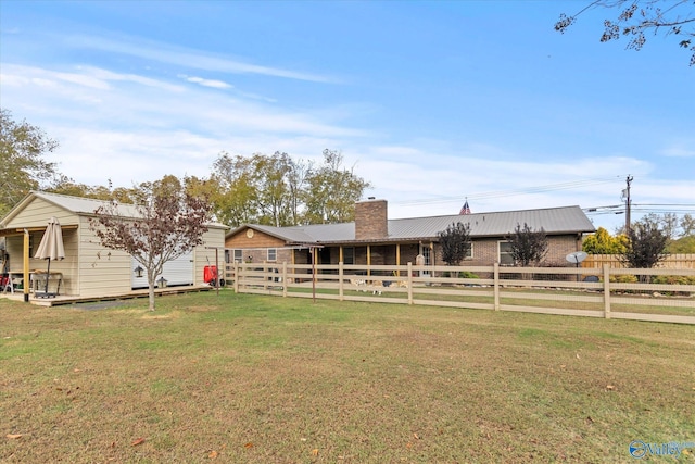 1707 Byron Rd, Scottsboro, AL 35769 - view of front facade featuring a metal roof and a chimney