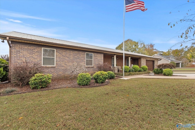 1707 Byron Rd, Scottsboro, AL 35769 - single story home with a garage, a front lawn, brick siding, and a metal roof