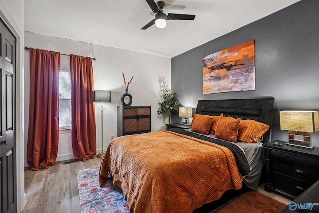bedroom featuring ceiling fan and hardwood / wood-style flooring