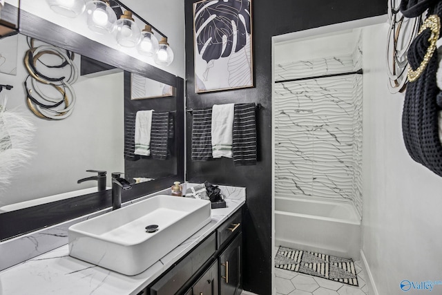 full bathroom with tile patterned floors, baseboards, vanity, and bathing tub / shower combination