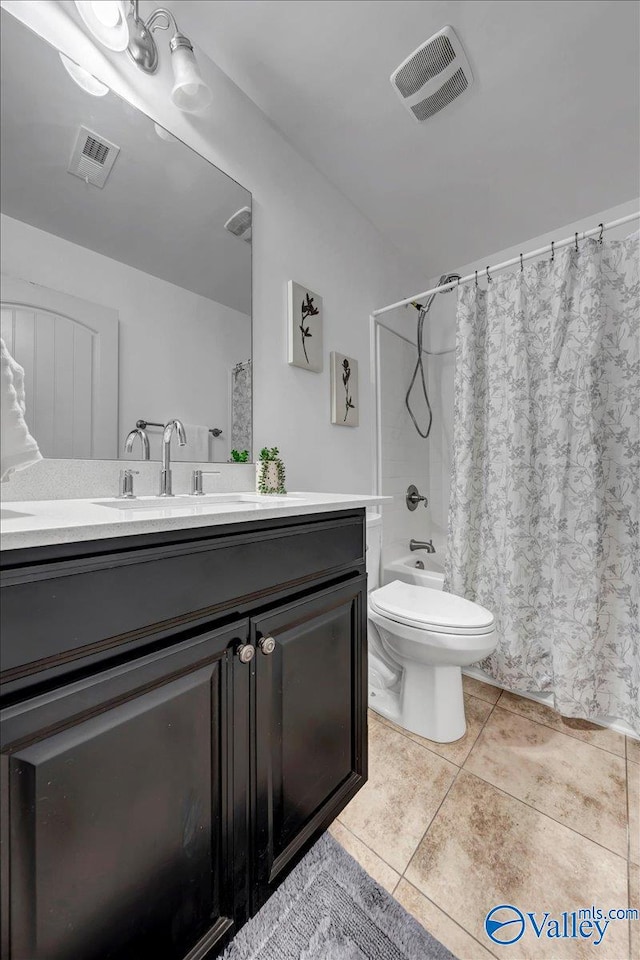 full bathroom featuring tile patterned flooring, vanity, shower / bath combination with curtain, and toilet