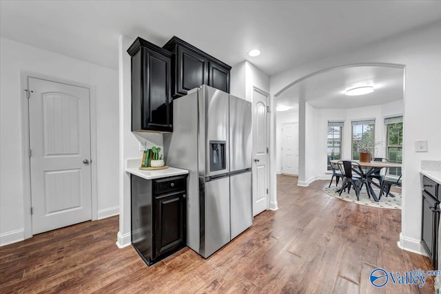 kitchen featuring hardwood / wood-style floors and stainless steel refrigerator with ice dispenser