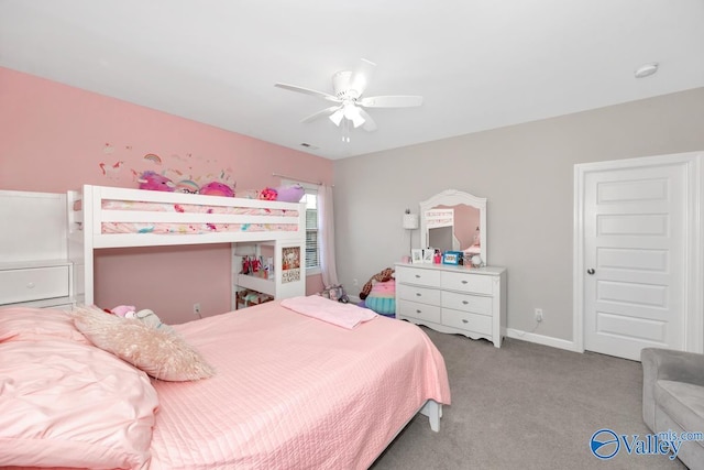 bedroom with baseboards, carpet floors, visible vents, and a ceiling fan