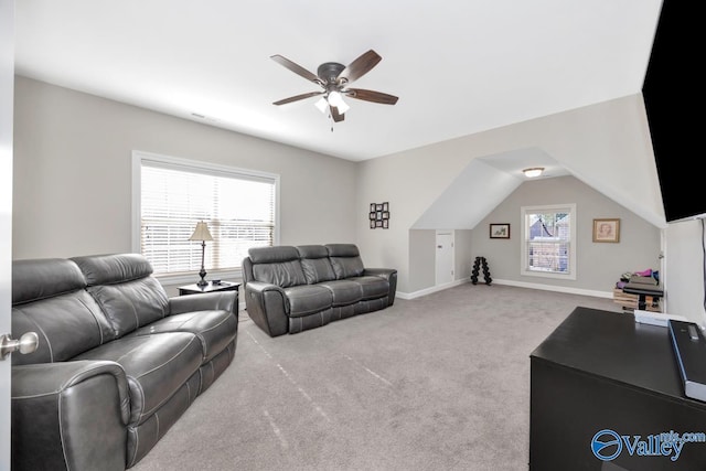 living area featuring carpet, baseboards, and ceiling fan