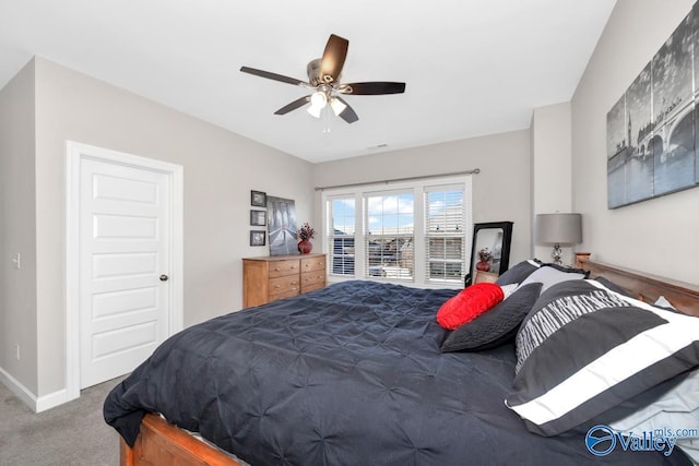 carpeted bedroom with baseboards and ceiling fan