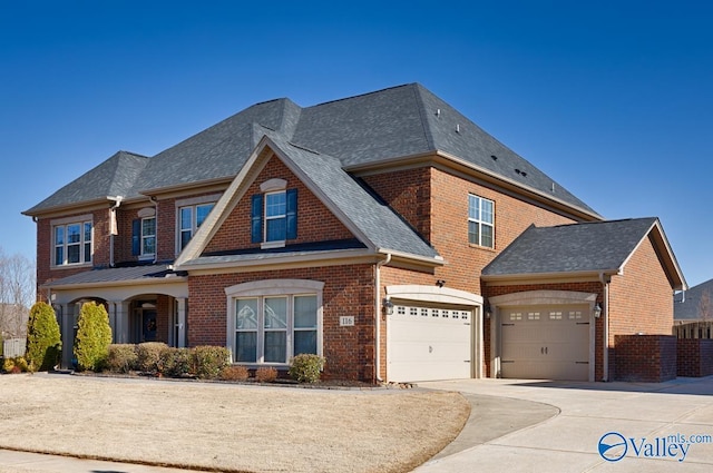 view of front facade with a garage, brick siding, concrete driveway, and a shingled roof