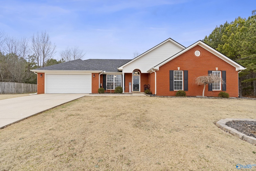 single story home with a garage and a front yard