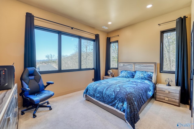 carpeted bedroom with baseboards, visible vents, and recessed lighting