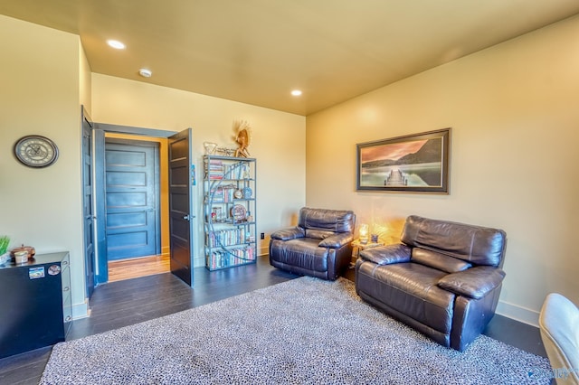 sitting room with recessed lighting, baseboards, and wood finished floors