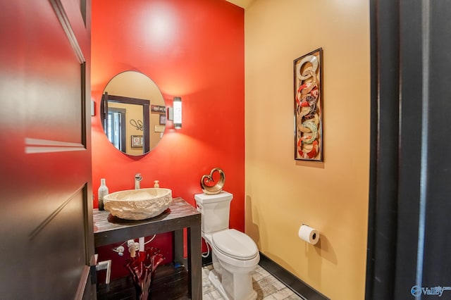 bathroom with a sink and toilet