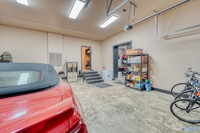 garage featuring electric panel and a garage door opener