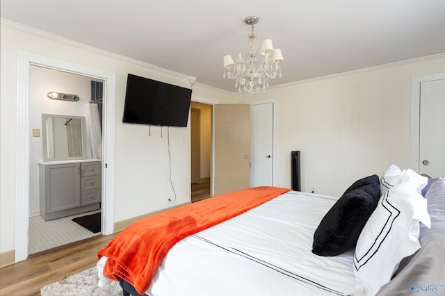 bedroom featuring baseboards, light wood-style flooring, a chandelier, and crown molding