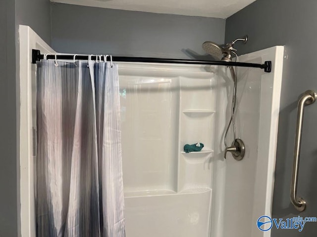 bathroom with a shower with shower curtain