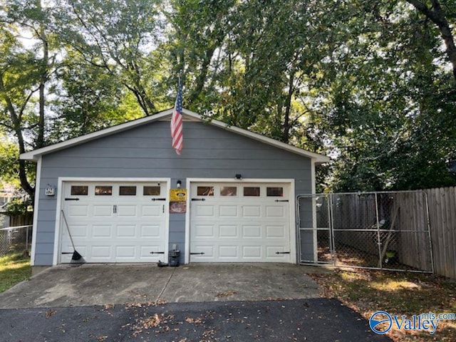 detached garage with fence