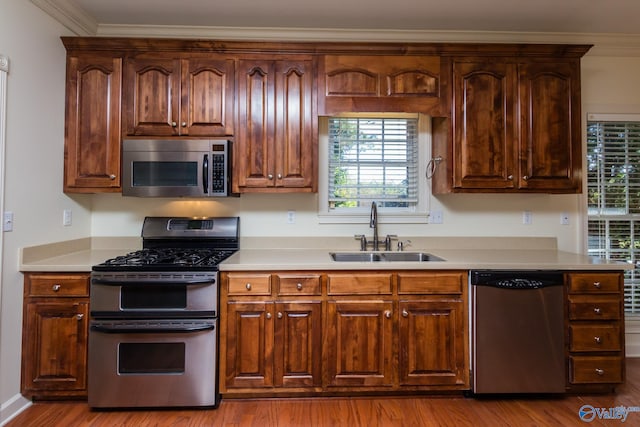 kitchen featuring light hardwood / wood-style floors, sink, and stainless steel appliances