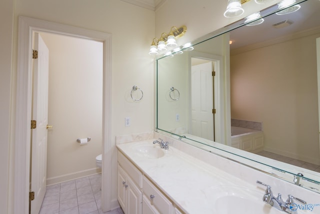 bathroom with tile patterned floors, crown molding, toilet, a bathtub, and vanity