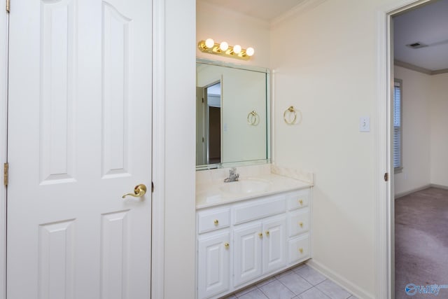 bathroom featuring tile patterned floors, vanity, and ornamental molding