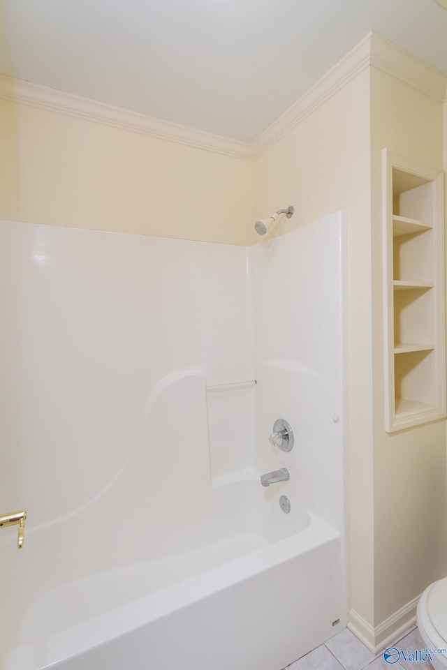 bathroom with tile patterned floors, toilet, bathtub / shower combination, and ornamental molding