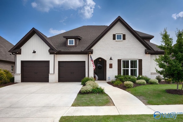 12 Cobbs Cove Way SE, Huntsville, AL 35803 - view of front of home featuring brick siding, driveway, a front yard, roof with shingles, and board and batten siding