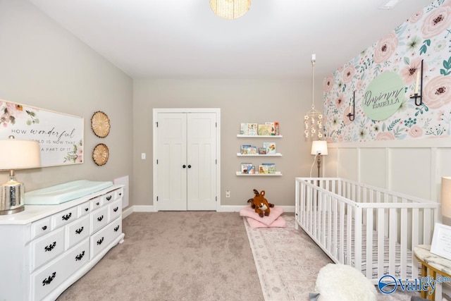 12 Cobbs Cove Way SE, Huntsville, AL 35803 - bedroom featuring light carpet, a crib, baseboards, and a closet