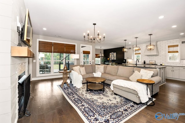 12 Cobbs Cove Way SE, Huntsville, AL 35803 - living area featuring a chandelier, dark wood-type flooring, recessed lighting, and a fireplace