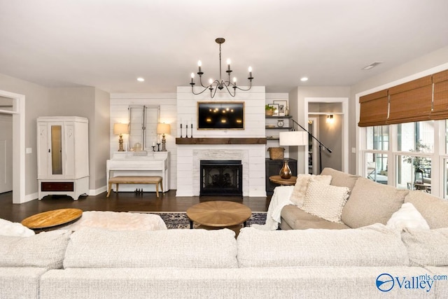 12 Cobbs Cove Way SE, Huntsville, AL 35803 - living room featuring a chandelier, baseboards, recessed lighting, a fireplace, and dark wood finished floors
