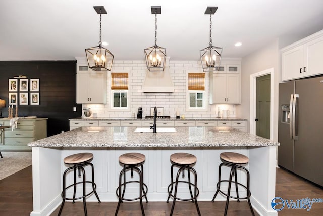 12 Cobbs Cove Way SE, Huntsville, AL 35803 - kitchen featuring stainless steel appliances, a chandelier, a sink, white cabinets, and a center island with sink
