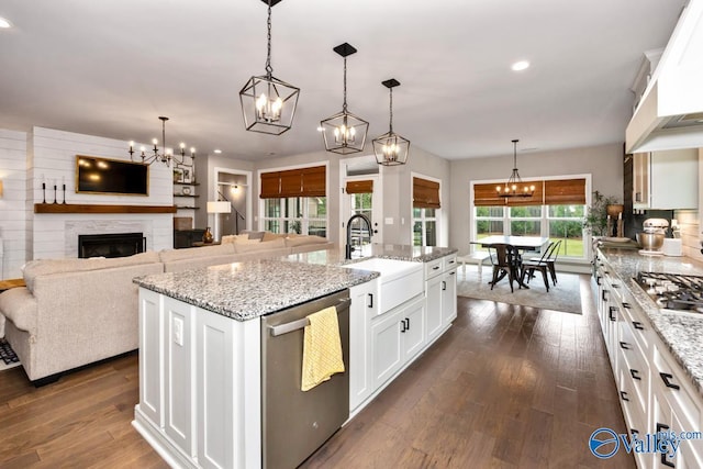 12 Cobbs Cove Way SE, Huntsville, AL 35803 - kitchen featuring stainless steel appliances, a sink, a chandelier, custom range hood, and an island with sink