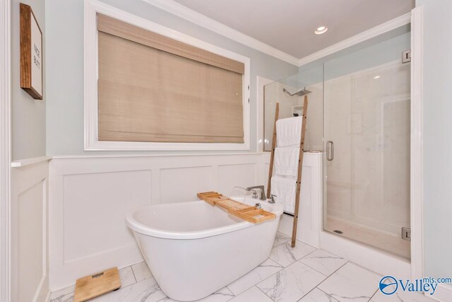 12 Cobbs Cove Way SE, Huntsville, AL 35803 - full bath with marble finish floors, a decorative wall, a stall shower, a freestanding bath, and ornamental molding
