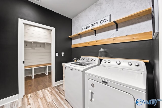 12 Cobbs Cove Way SE, Huntsville, AL 35803 - washroom with separate washer and dryer, light wood finished floors, and baseboards