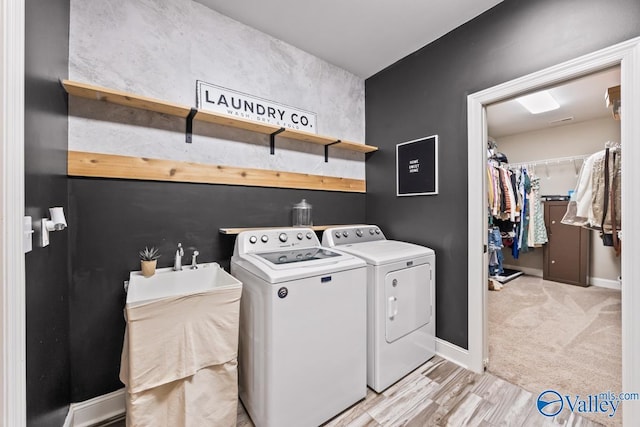12 Cobbs Cove Way SE, Huntsville, AL 35803 - laundry area featuring separate washer and dryer, baseboards, and light wood-style floors