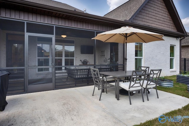 12 Cobbs Cove Way SE, Huntsville, AL 35803 - view of patio / terrace with outdoor dining area and a sunroom