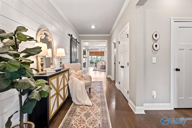 12 Cobbs Cove Way SE, Huntsville, AL 35803 - hall featuring a barn door, crown molding, dark wood-type flooring, and baseboards