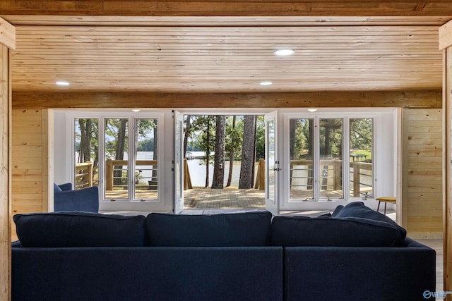 living room with recessed lighting, wood walls, and wood ceiling