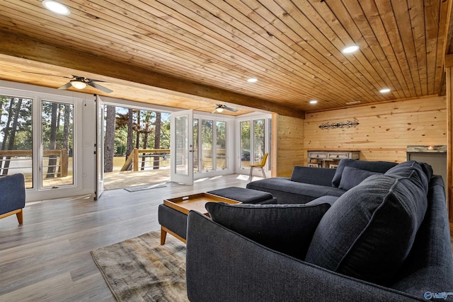 living room featuring plenty of natural light, a ceiling fan, recessed lighting, and wooden ceiling