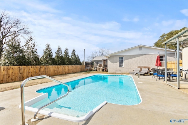 view of pool featuring a patio