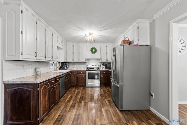 kitchen featuring appliances with stainless steel finishes, sink, white cabinets, and dark hardwood / wood-style flooring