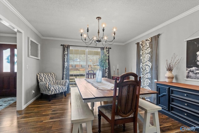 dining room with ornamental molding, dark hardwood / wood-style floors, a textured ceiling, and a chandelier