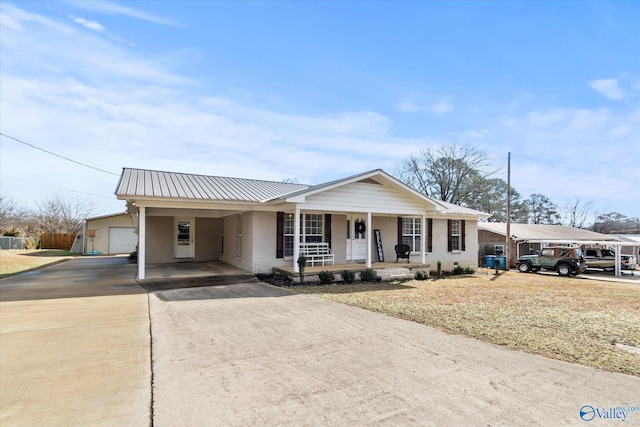 single story home featuring a carport and covered porch