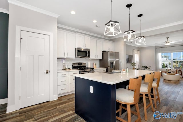 kitchen with crown molding, decorative backsplash, stainless steel appliances, and dark wood-type flooring